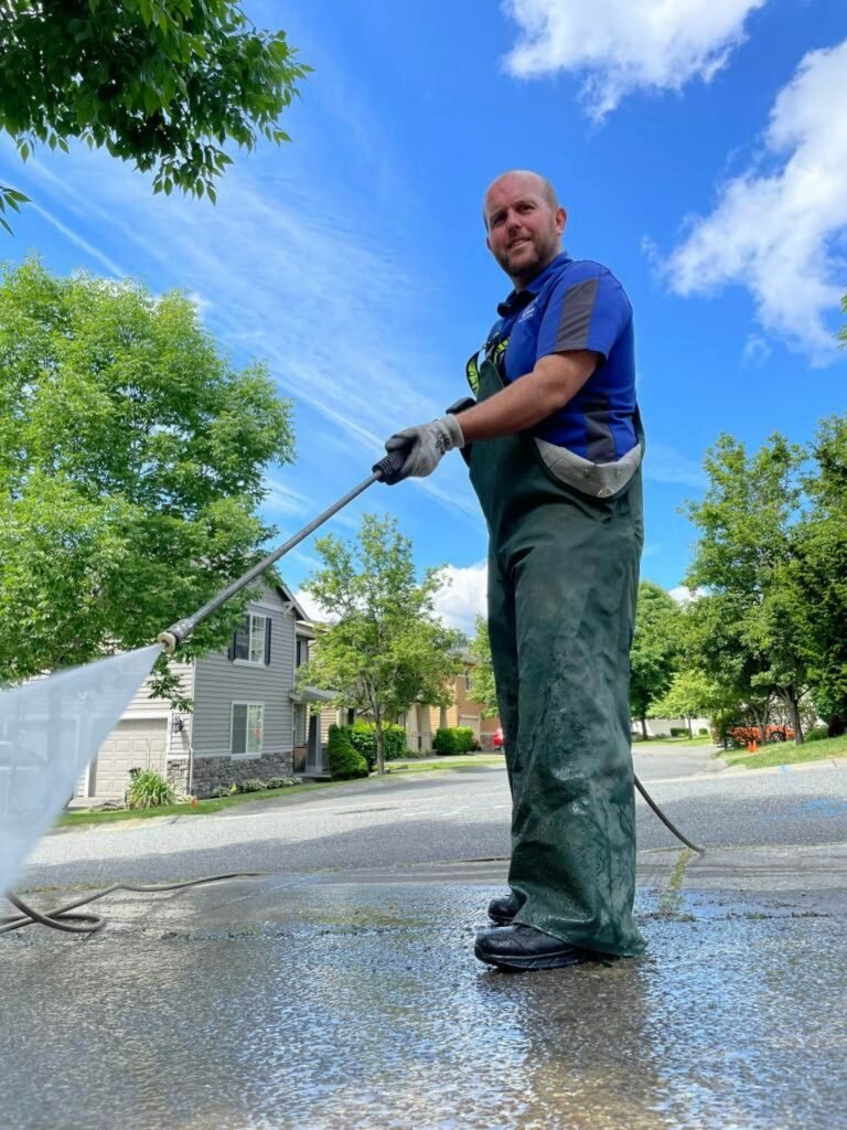 Pressure washing a home exterior in Northwest Washington